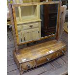 A 19th century mahogany bow-front swing toilet mirror, with 3 short drawers, W50cm