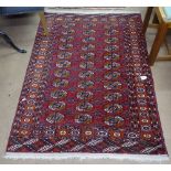 A red ground Turkemon rug, 145cm x 100cm