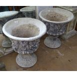 A pair of concrete 2-section garden urns, with embossed decoration, W51cm, H57cm