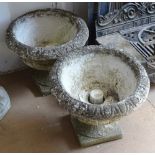 A pair of weathered concrete country style urns on stand, H36cm