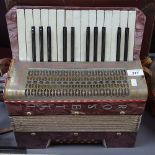 A Rosetti piano accordion with case