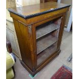 A Victorian walnut and ebonised pier cabinet, with single glazed door, and ormolu mounts, W79cm