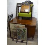 A mahogany drop leaf dining table, a bobbin turned stool, brass fender, firescreens etc