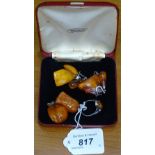 8 pieces of Baltic amber jewellery with silver mounts, to include pendants and earrings