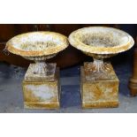 A pair of small cast-iron 2-section garden urns on pedestals, H44cm