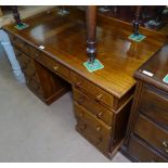 An Edwardian mahogany twin-pedestal writing desk, with fitted drawers, W120cm