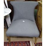 A modern upholstered armchair on tapered legs