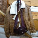 A sheepskin jacket, and a man's leather satchel