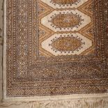 A brown ground Persian design silk runner, 180cm x 65cm