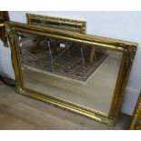 2 modern gilt-framed wall mirrors