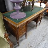 A late 19th century mahogany pedestal writing desk, with 7 fitted drawers, raised on tapered legs,