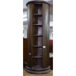 A hardwood circular revolving bookcase, H96cm