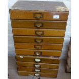 An oak-fronted Vintage bank of 6 drawers, height 15.5", and a matching bank of 4 filing drawers