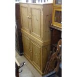 A pair of modern polished pine 2-door cabinets, W122cm