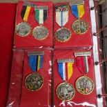 An album of Vintage Continental sporting medallions etc