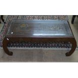 A Chinese hardwood opium table, with relief carved decoration on scrolled legs, L100cm