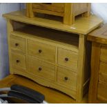 A modern light oak TV stand with 6 fitted drawers, W84cm