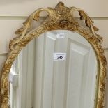 An Arch-top Atsonea wall mirror in carved, gilded and painted frame, height 28.5"