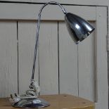 A chrome desk lamp