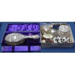 An Art Nouveau embossed silver-backed dressing table brush, boxed, 3 silver-topped dressing table