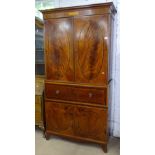 An Antique mahogany 2-section secretaire cabinet, the 2-door cupboard top with oval inlaid panels