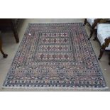 A needlework Sumak Kilim rug, 186cm x 135cm