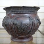 A Japanese bronze jardiniere with embossed birds and blossom decorated panels, lacking base,
