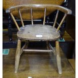 A child's Victorian bow-arm stick-back chair with elm seat