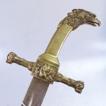 An replica sword with brass lion mask and eagle's head handle, 35"