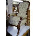 A Victorian mahogany-framed and button-back upholstered open armchair