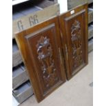 A pair of French walnut panelled doors, with applied carved decoration