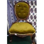 A Victorian mahogany-framed and upholstered nursing chair