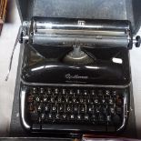 A Vintage Optima portable typewriter with case