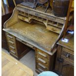 A 1920s oak 3-section roll-top pedestal desk, W121cm