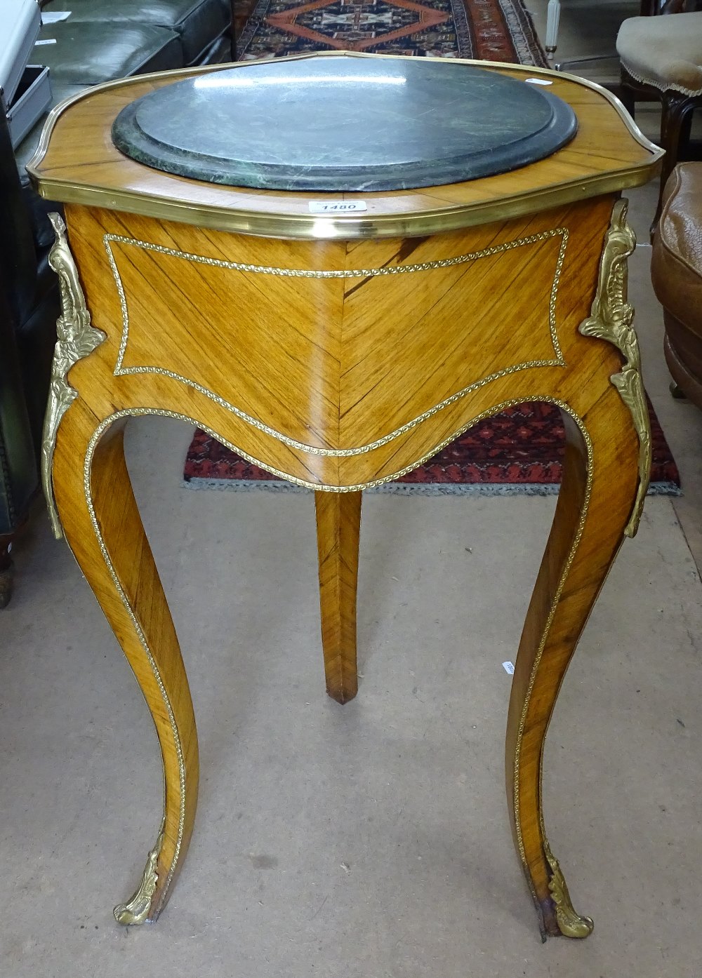 A Continental walnut marble-top jardiniere stand, shaped frieze, raised on cabriole legs, with