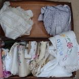 A fibreboard suitcase containing lace, christening gown, embroidery etc