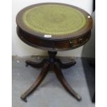 A reproduction mahogany drum table