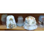 A shelf of Vintage glass light shades