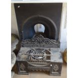 A Victorian cast-iron fire surround, and a Victorian cast-iron dog grate