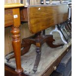 A Regency mahogany drop leaf breakfast table, end frieze drawer, raised on a platform base with