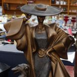 An Austin patinated sculpture of a lady and a dog, height 19.5"