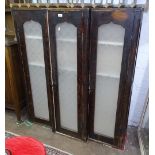 A stained pine breakfront cabinet with 3 etched glazed doors, W117cm