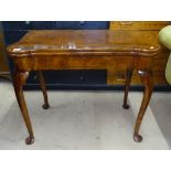 A burr-walnut fold over card table of shaped form, raised on cabriole legs, with pad feet