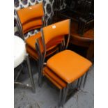A set of 6 mid-century stacking kitchen chairs