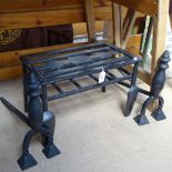 A cast-iron footman, 17" across, and a pair of firedogs