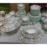 A Minton "Haddon Hall" dinner service, including 3 covered vegetable tureens, meat plates etc