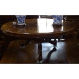 A Victorian burr-walnut oval coffee table, on scrolled tripod base, L135cm