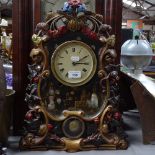 An American wall clock with painted panel, height 25", and another clock with cast-floral surround