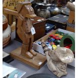 A carved wood novelty figure nutcracker, 14", and a pottery pipe, modelled as a man wearing a