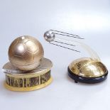 A Russian Sputnik design musical box, and a 1980 USSR Olympics football musical box, length 5.5"